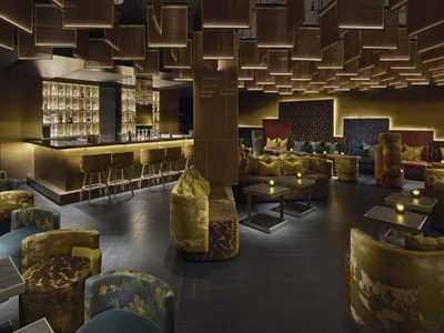 Bar and lounge area with coloured seating Bar and lounge area with coloured seating