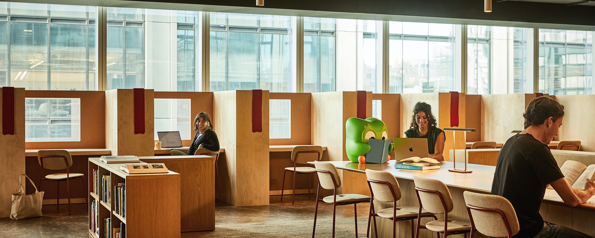 Library area with seating and booths Library area with seating and booths