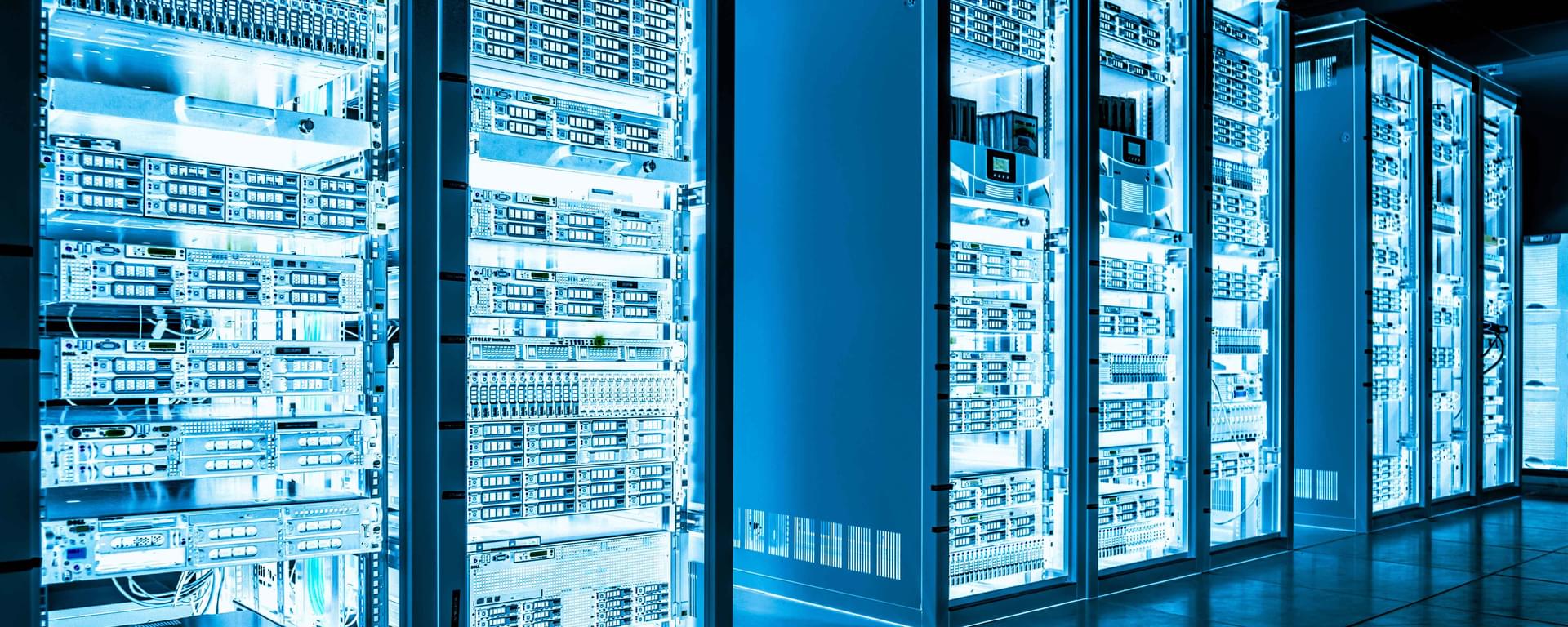 Big data dark server room with bright blue equipment