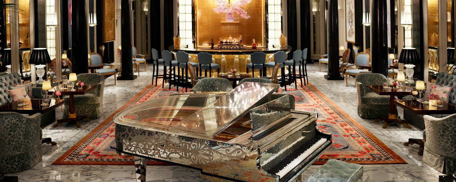 The Dorchester Hotel - bar area with mirrored grand piano in the foreground