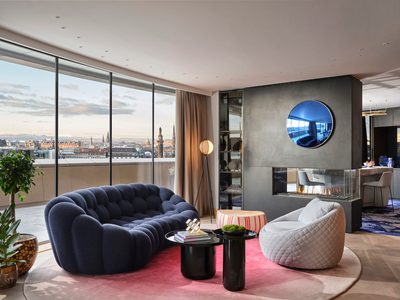 W Edinburgh - seating in guest suite with large blue sofa W Edinburgh - seating in guest suite with large blue sofa
