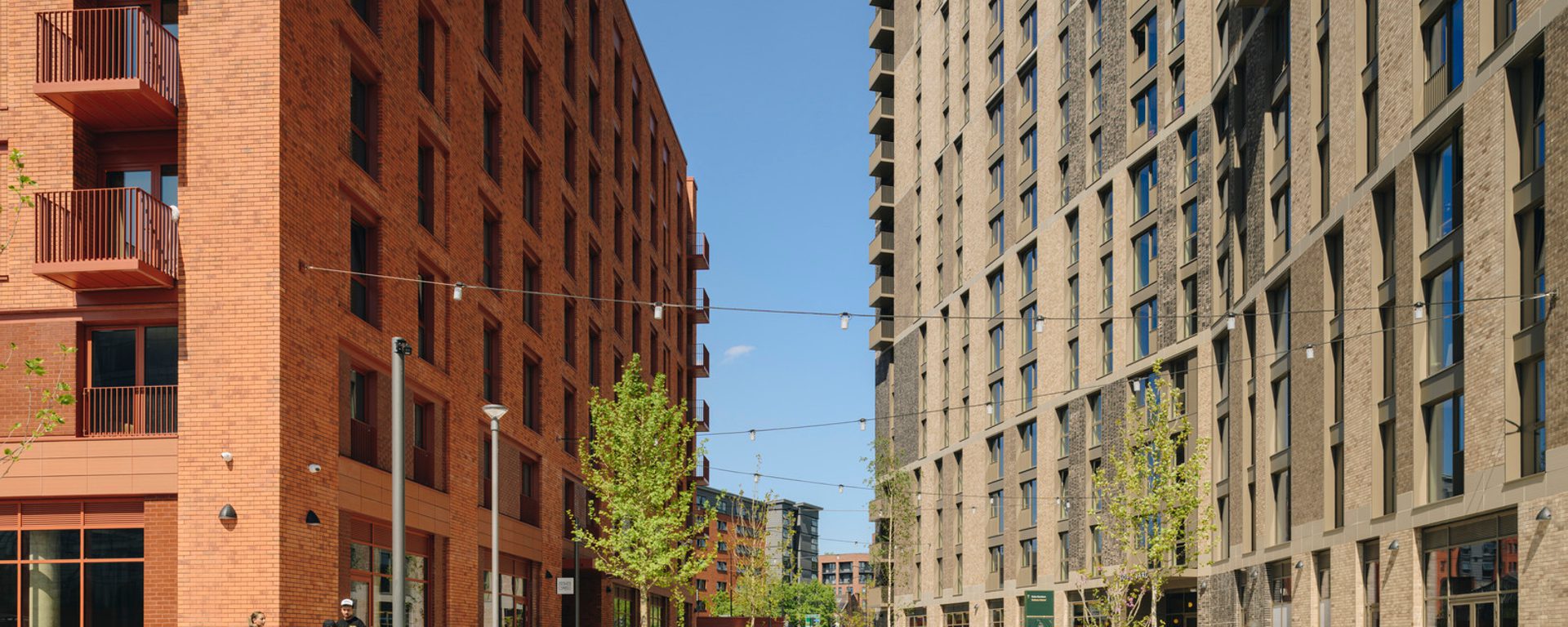 Exterior of new buildings with public realm and trees Exterior of new buildings with public realm and trees